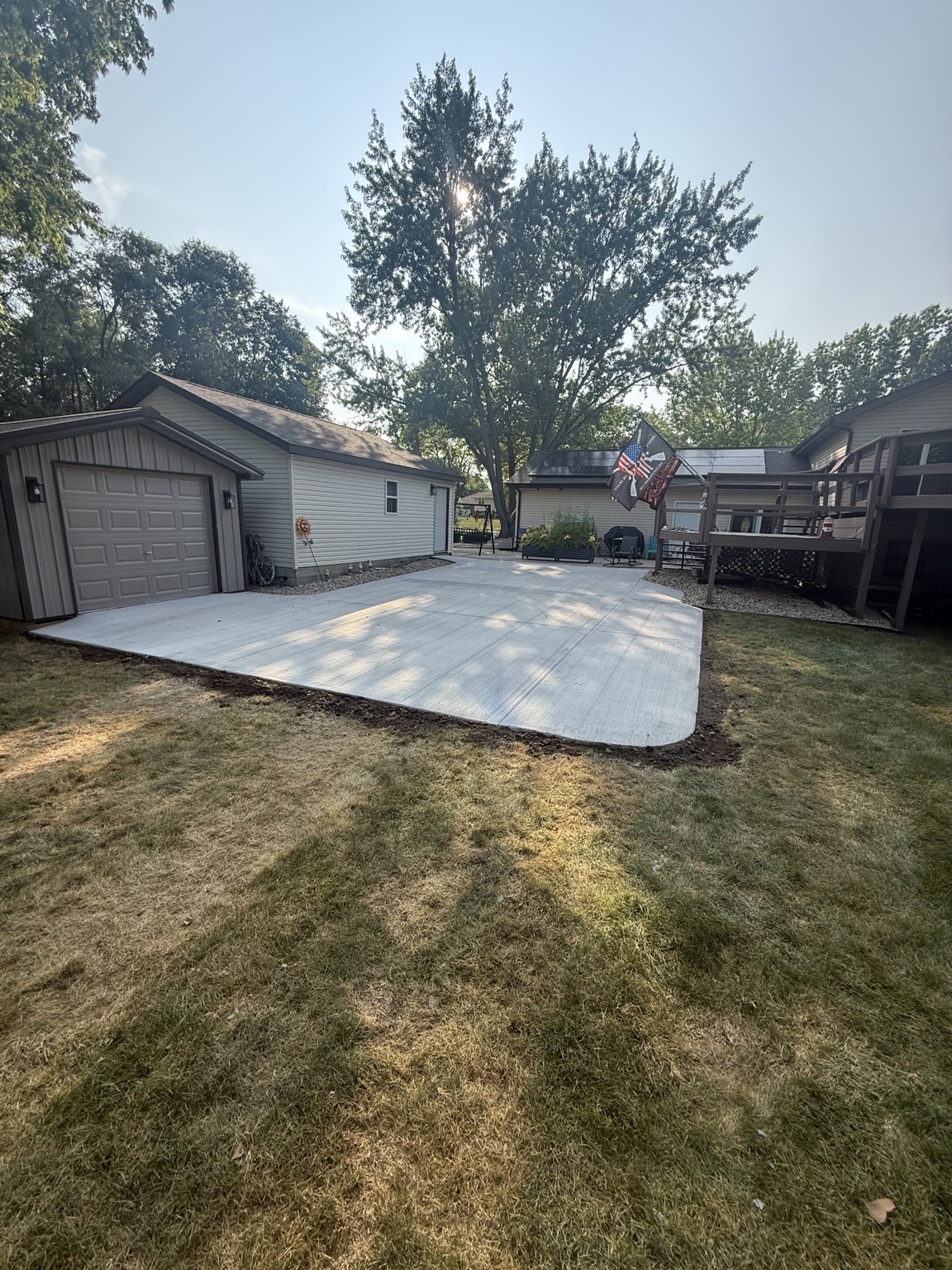 Completed concrete patio and driveway area
